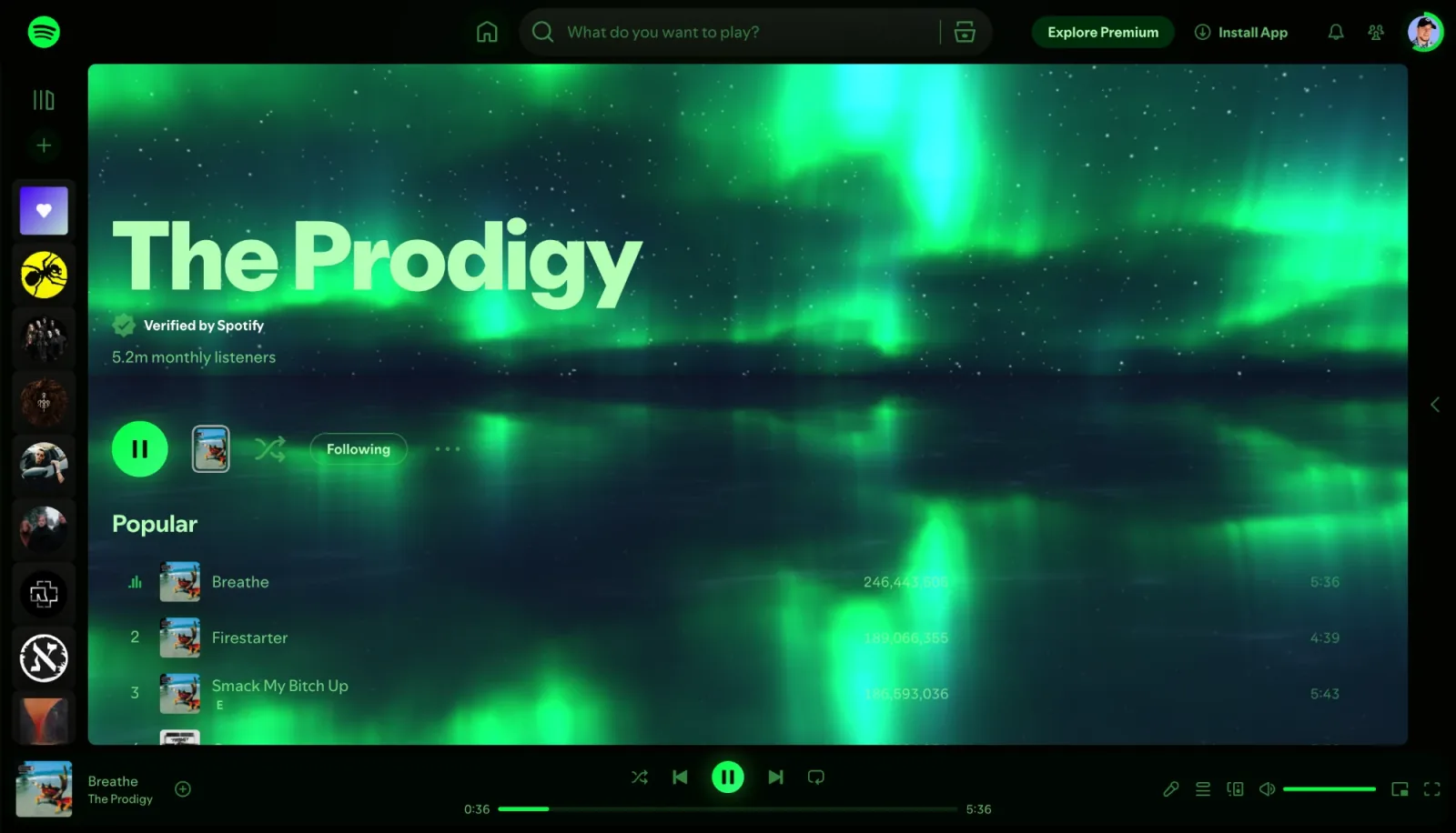 The Prodigy artist page in the Spotify web player with a Deus theme: a black page with green text and buttons, over a green aurora reflected in water.